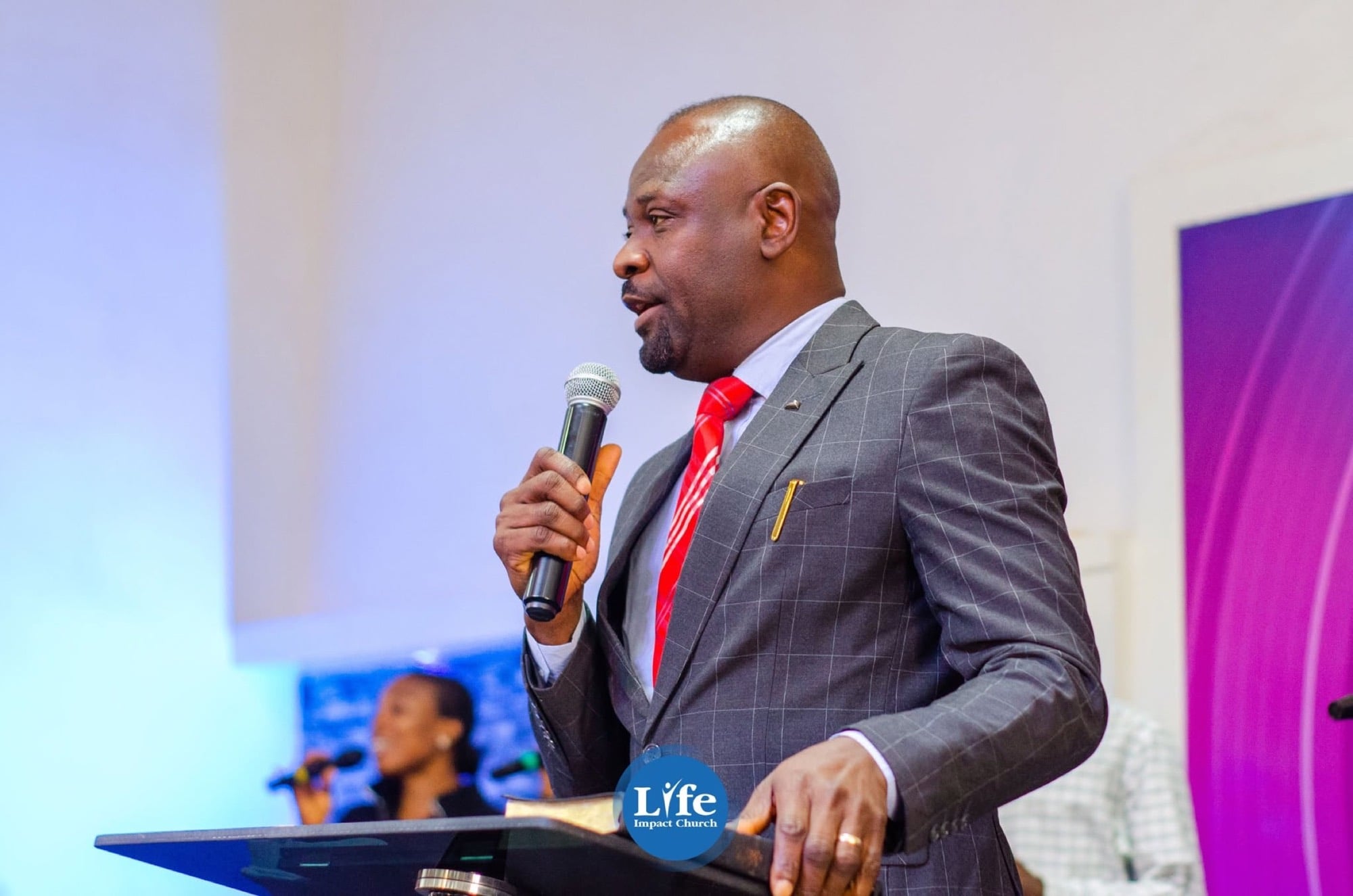 A pastor preaching from the pulpit